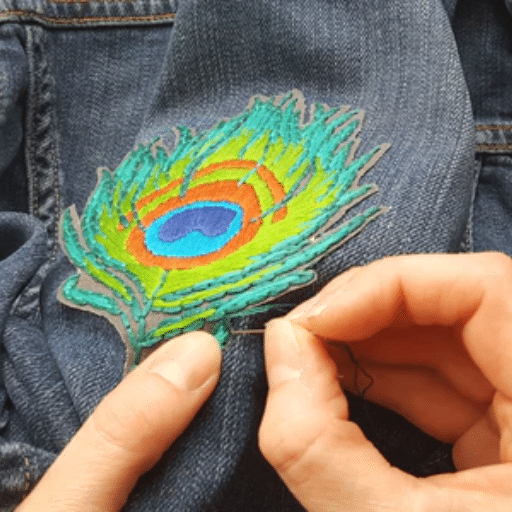 How do you finish and attach an embroidered patch