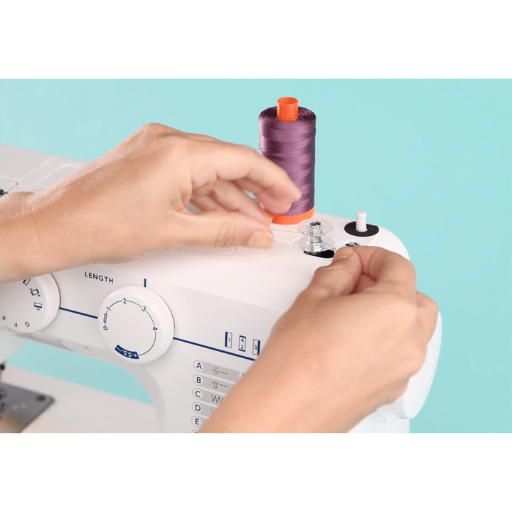 How do you thread the machine and prepare the bobbin