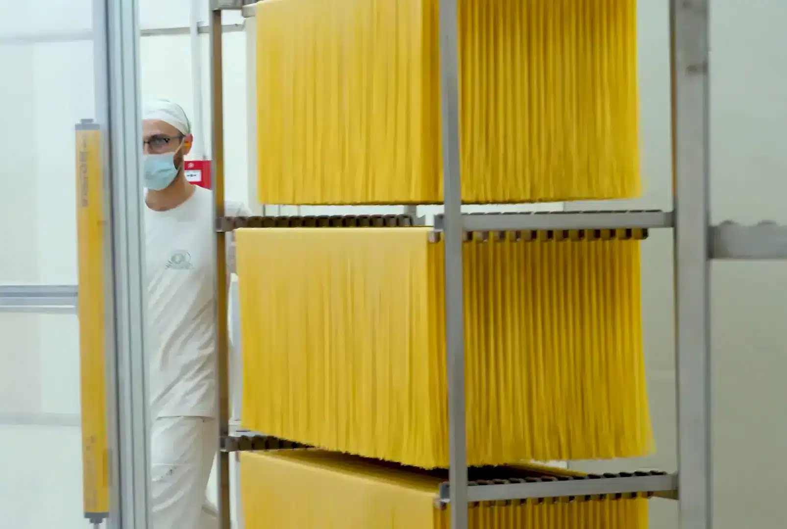 Pasta being extruded through bronze dies