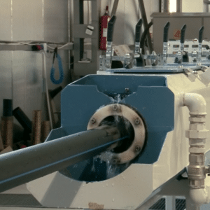 How does cooling impact the HDPE pipe extrusion process