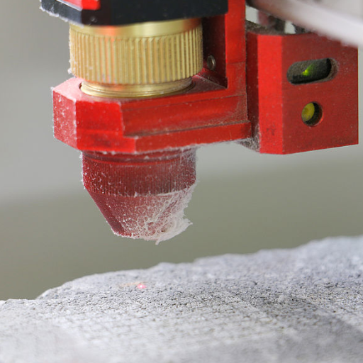 What are the steps to successfully engrave stone using a laser machine?